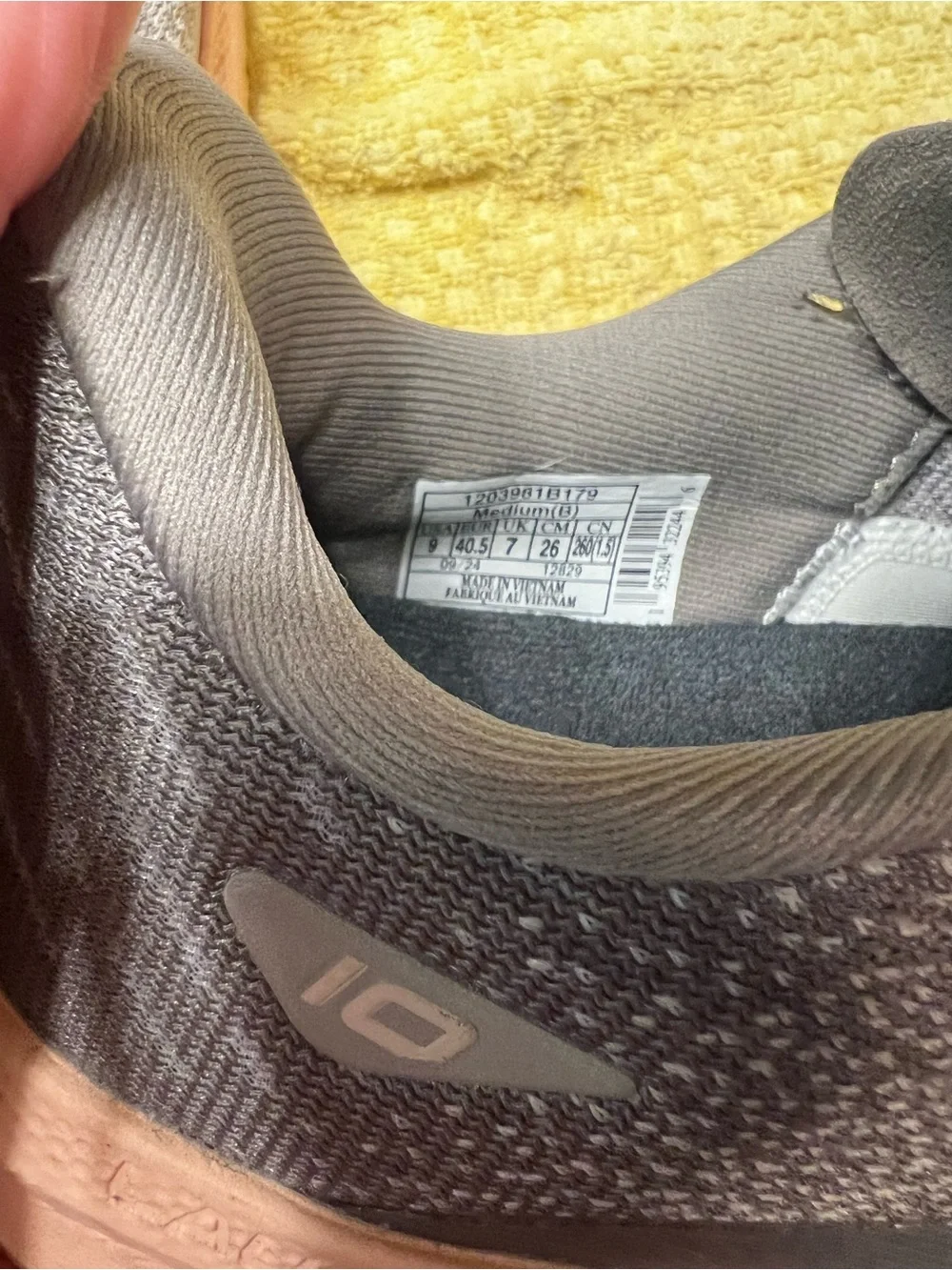 Brooks gray running shoes with pinkish peach midsole